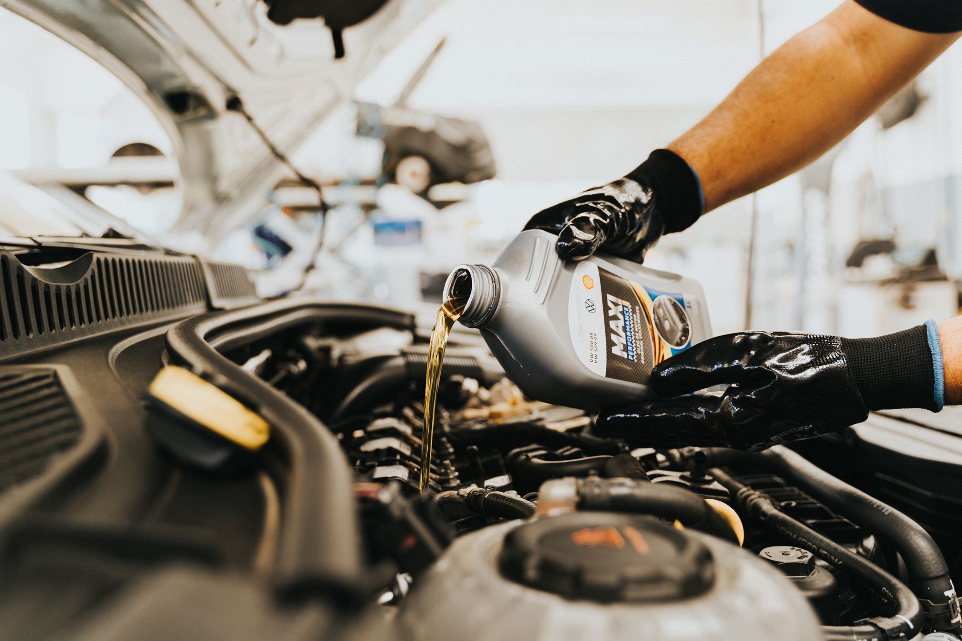 mechanic performing car oil change service