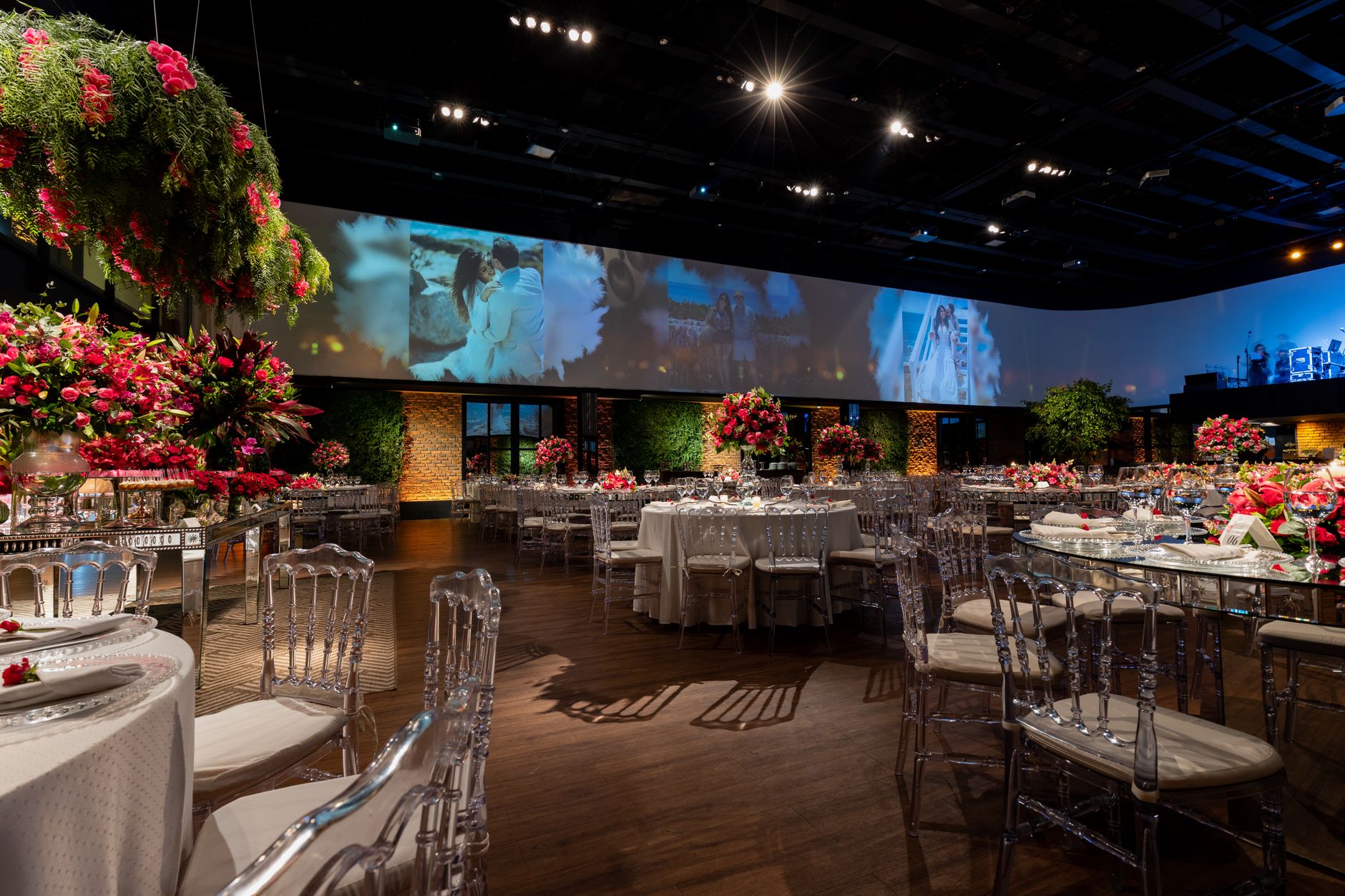 Elegant table setting with floral decorations inside a professional event venue