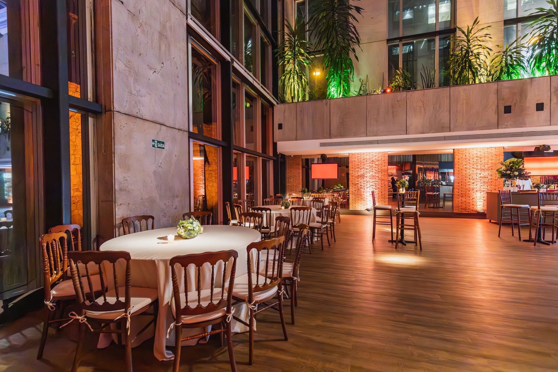 intimate party gathering in a well lit venue with table settings