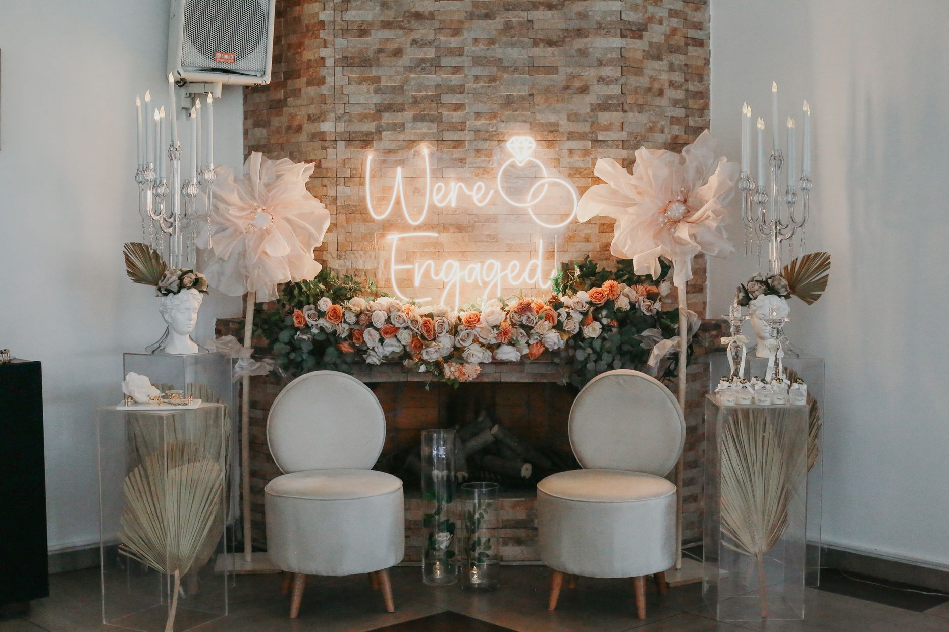 elegant engagement setup with floral arrangements