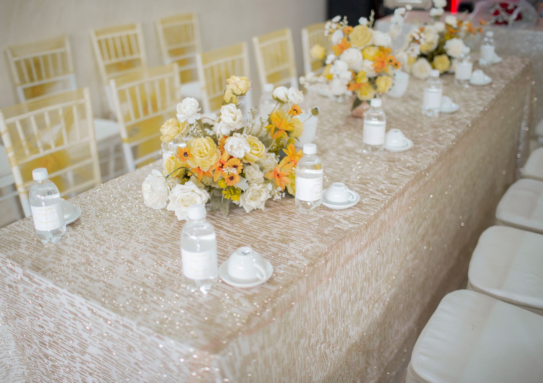 A bright cozy and elegantly decorated small event venue with minimalist floral a