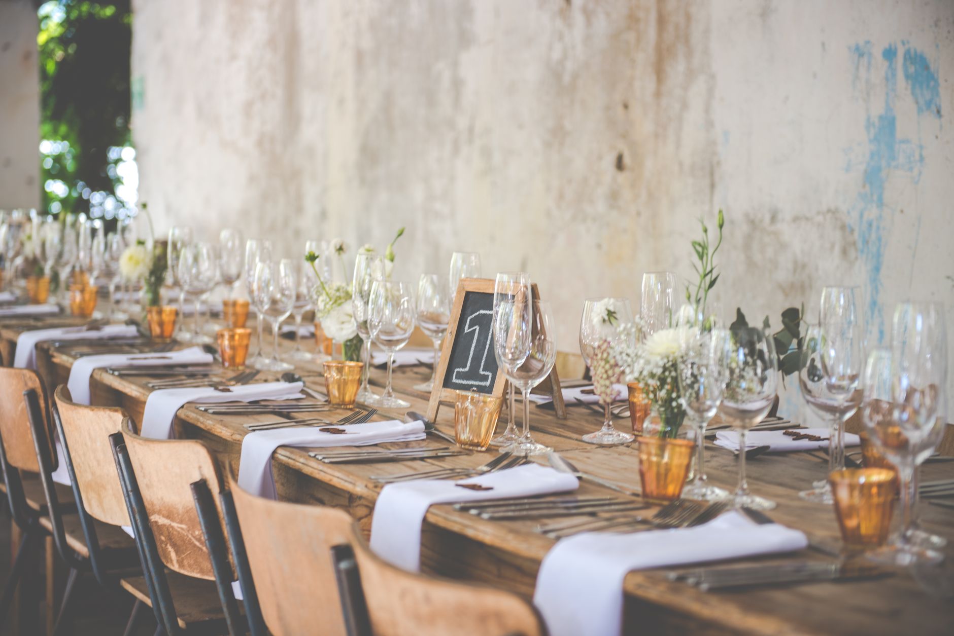 Close-up shot of a beautifully set table with minimalist decor for a special gat