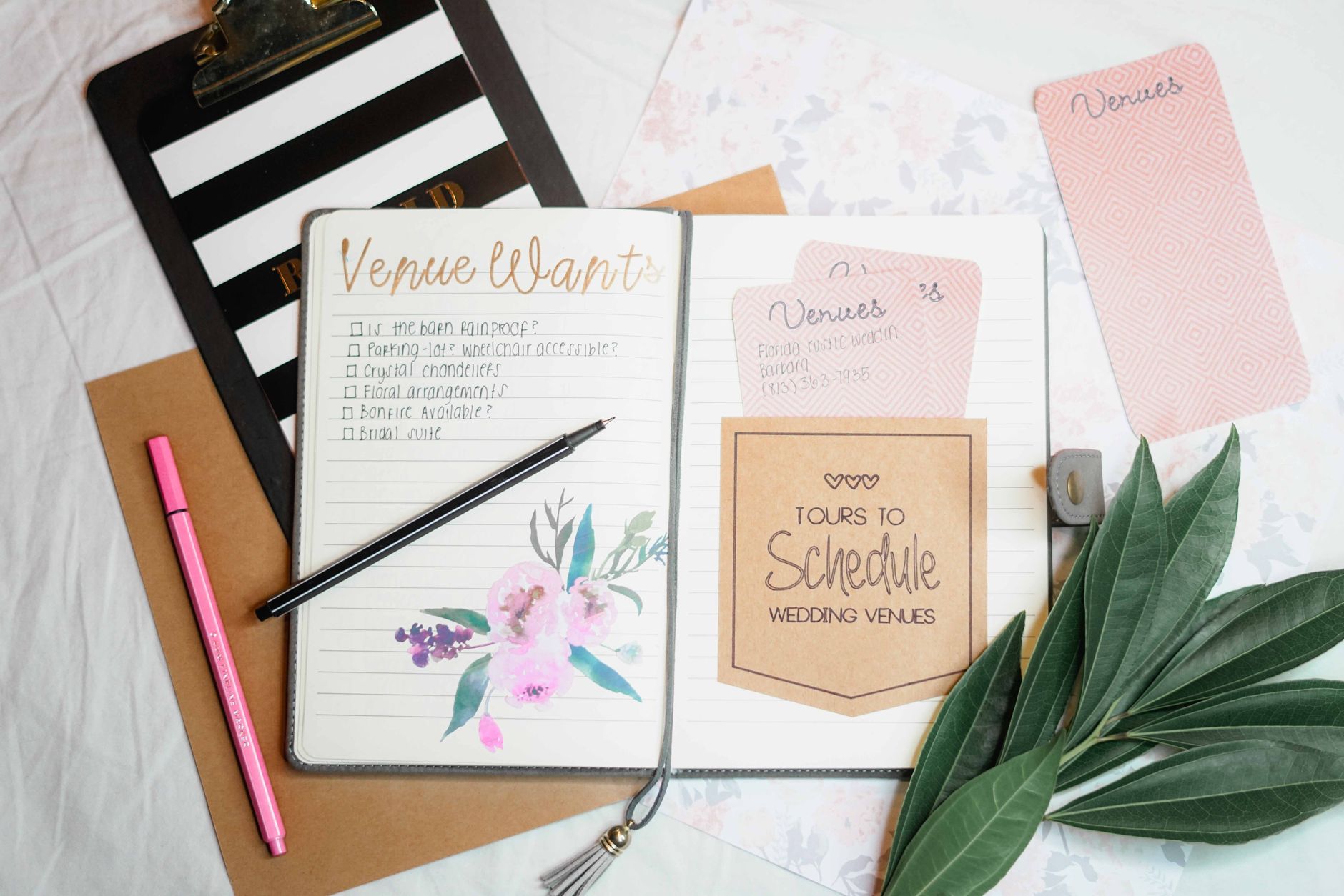 event planning checklist on a notebook with warm lighting